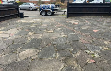 Crazy paving driveway before jet washing